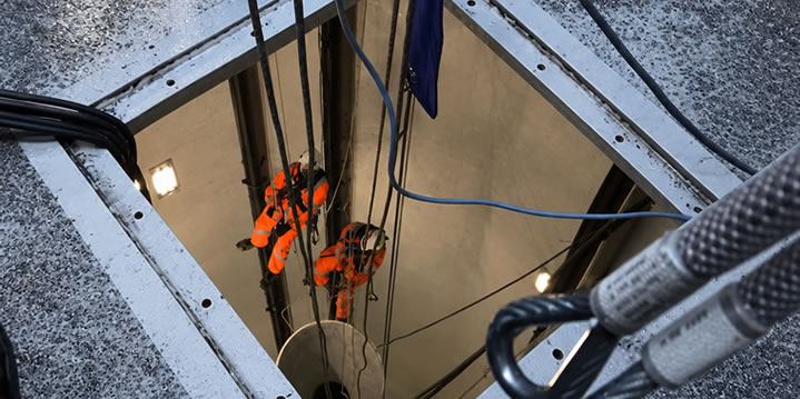 Technicians working inside an offshore wind foundation structure